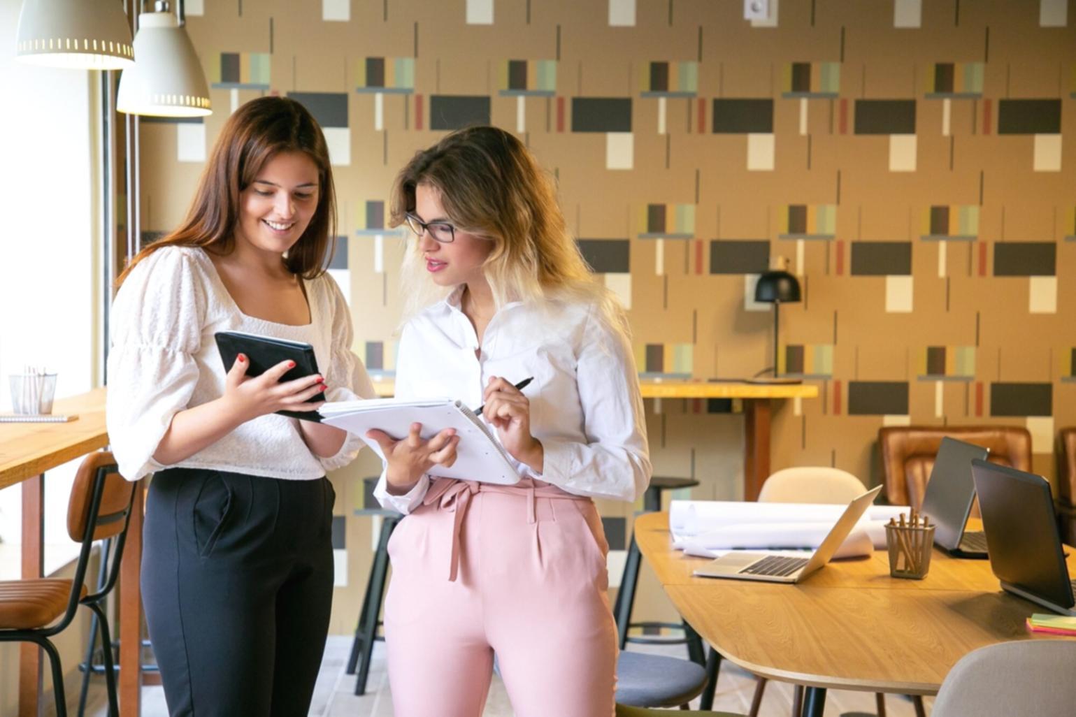 Financial professionals reviewing capital budgeting models and investment analysis documents in a collaborative learning environment